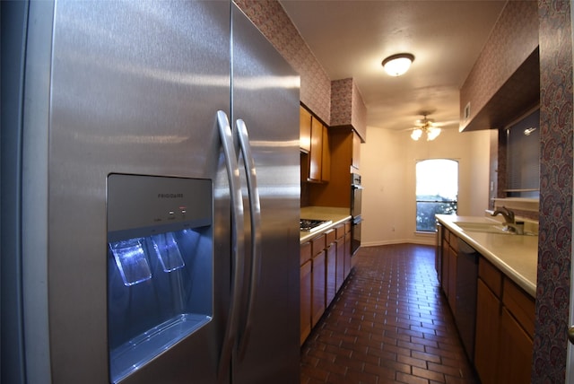 kitchen featuring ceiling fan, sink, and appliances with stainless steel finishes