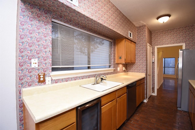 kitchen featuring stainless steel refrigerator, dishwasher, sink, wine cooler, and dark hardwood / wood-style flooring