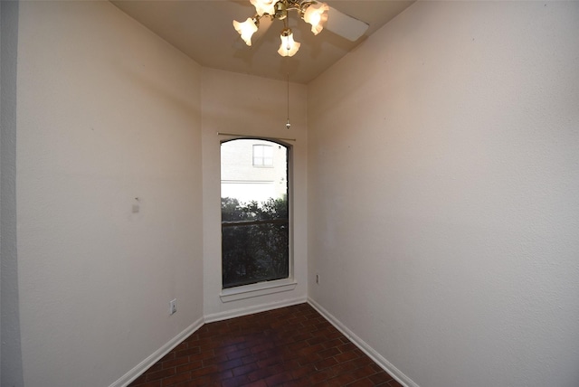 unfurnished room with ceiling fan