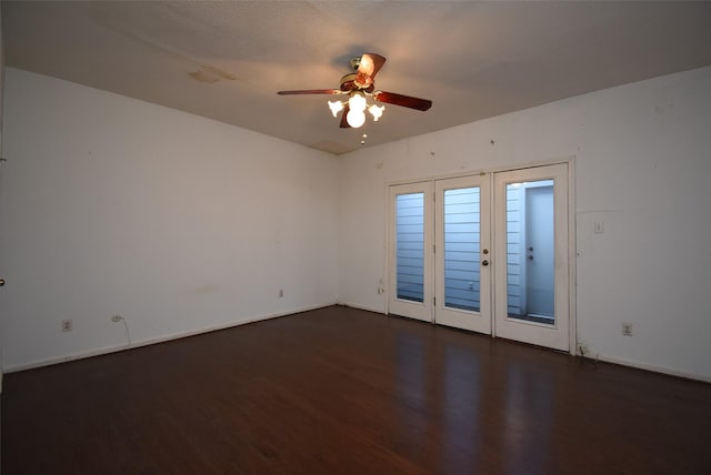 spare room featuring a textured ceiling, dark hardwood / wood-style floors, and ceiling fan