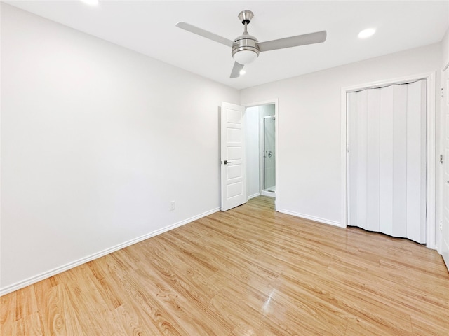 unfurnished bedroom with ceiling fan, a closet, and light wood-type flooring