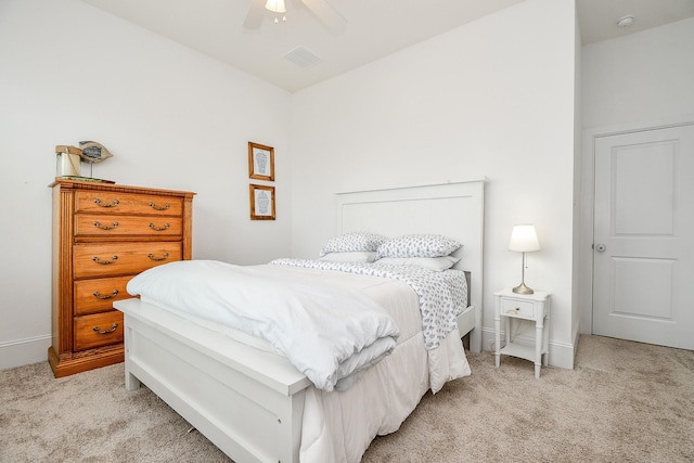 bedroom featuring ceiling fan and light carpet