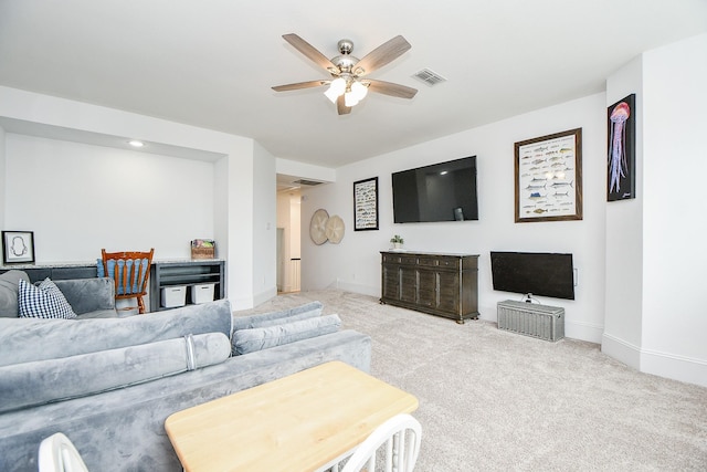 living room with light carpet and ceiling fan