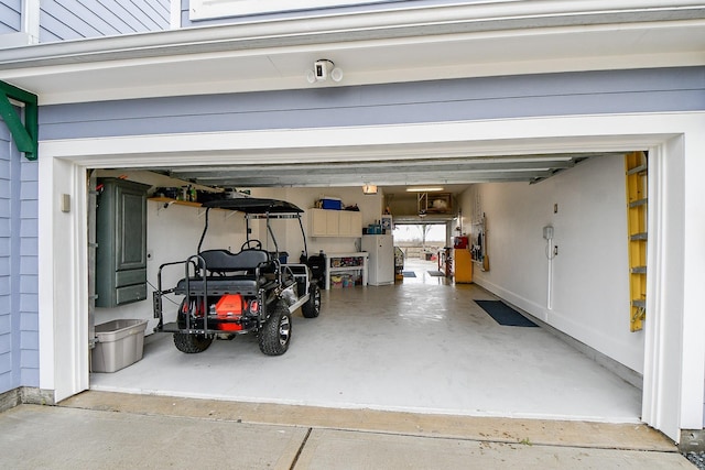 garage featuring white fridge