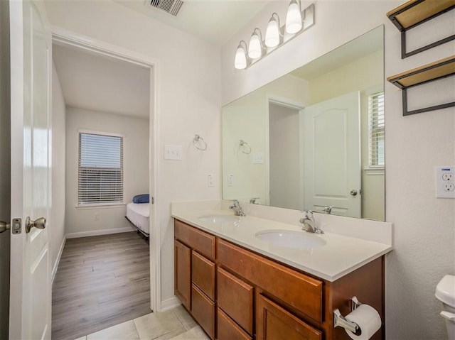 bathroom featuring hardwood / wood-style flooring and vanity