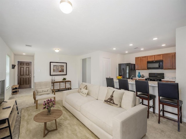 living room featuring light colored carpet