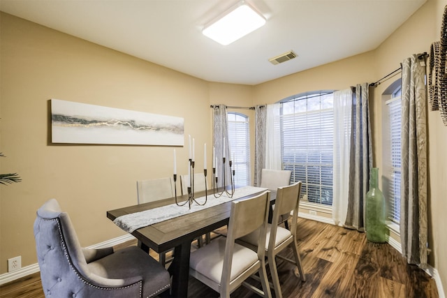 3102 Silver Cedar Trl, Katy, TX 77449 - dining room with dark wood-type flooring and baseboards
