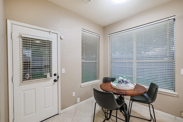 3102 Silver Cedar Trl, Katy, TX 77449 - dining space featuring baseboards and light tile patterned flooring