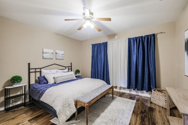 bedroom featuring hardwood / wood-style floors and ceiling fan