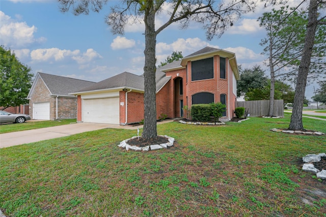 view of front of home with a front yard and a garage