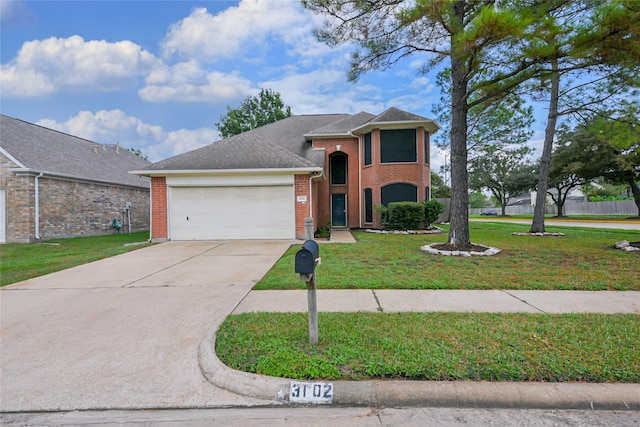 view of front of property featuring a front yard and a garage