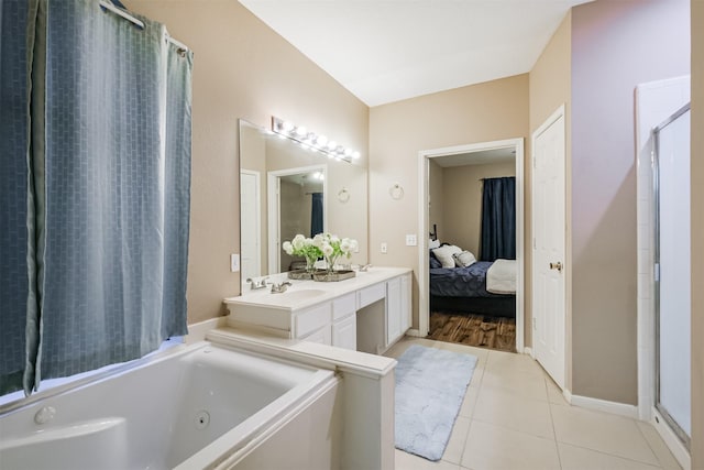 3102 Silver Cedar Trl, Katy, TX 77449 - full bath featuring a tub with jets, tile patterned floors, a shower, ensuite bathroom, and double vanity