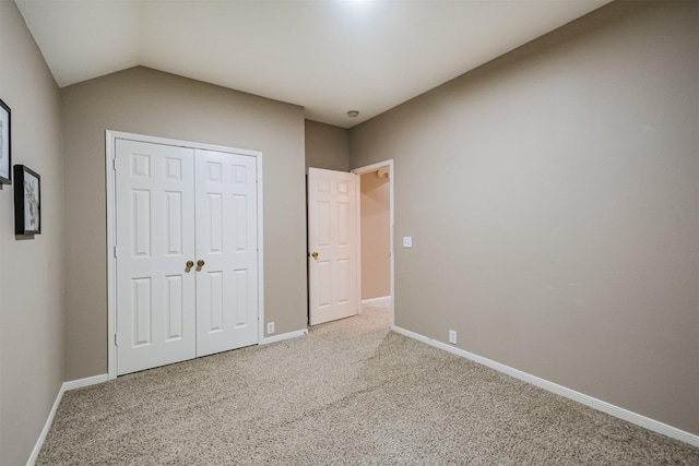 3102 Silver Cedar Trl, Katy, TX 77449 - unfurnished bedroom featuring carpet flooring, baseboards, a closet, and vaulted ceiling