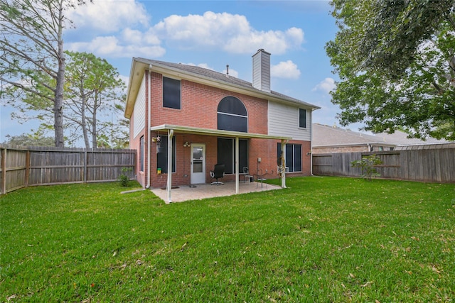 3102 Silver Cedar Trl, Katy, TX 77449 - rear view of property featuring brick siding, a chimney, and a patio