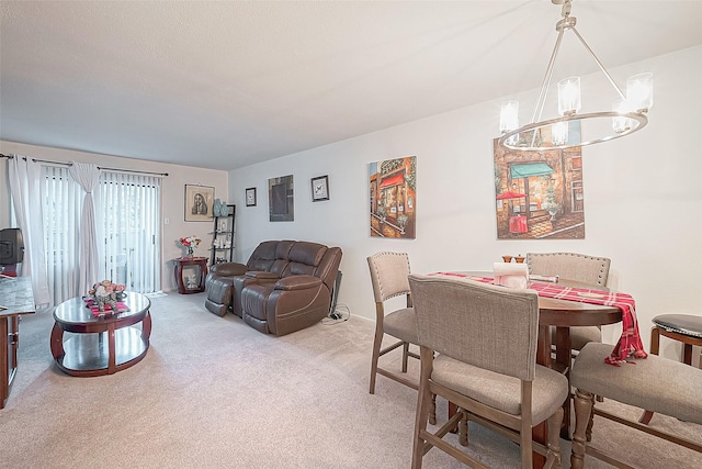 carpeted dining area with a notable chandelier