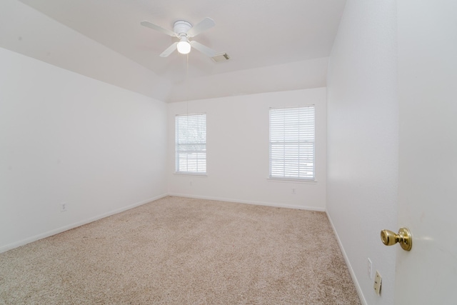 unfurnished room featuring light carpet and ceiling fan