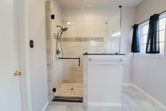 bathroom with a shower with shower door