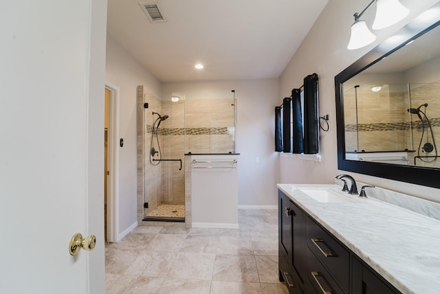 bathroom featuring vanity and an enclosed shower