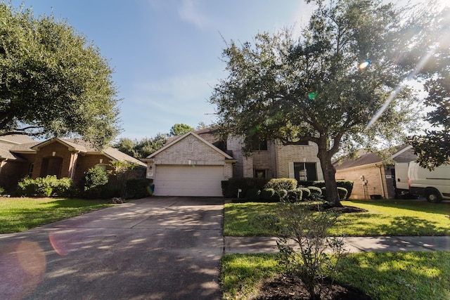 view of front of home with a garage and a front lawn