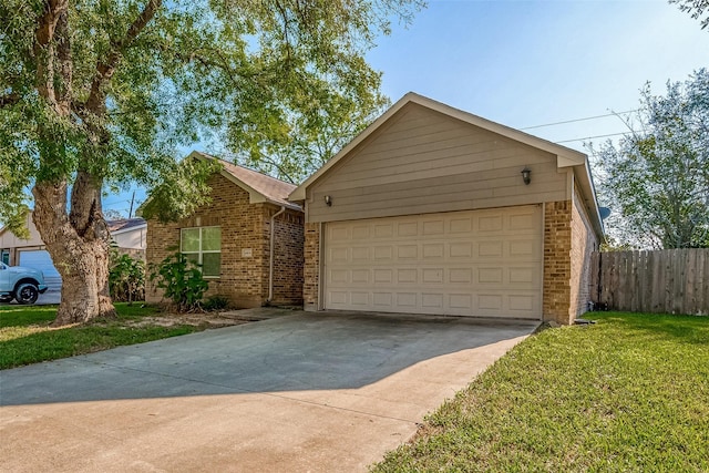 ranch-style house featuring a garage and a front yard