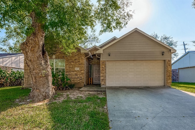 ranch-style house featuring a garage and a front lawn