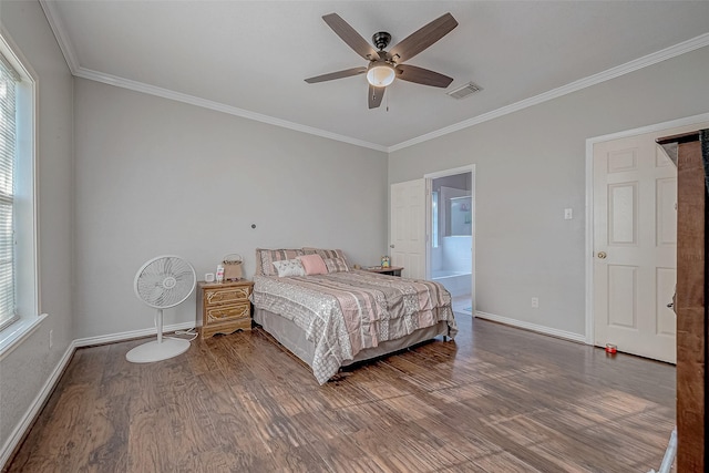 bedroom featuring connected bathroom, multiple windows, hardwood / wood-style flooring, ornamental molding, and ceiling fan