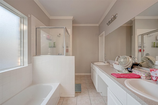 bathroom featuring tile patterned floors, shower with separate bathtub, vanity, and a wealth of natural light