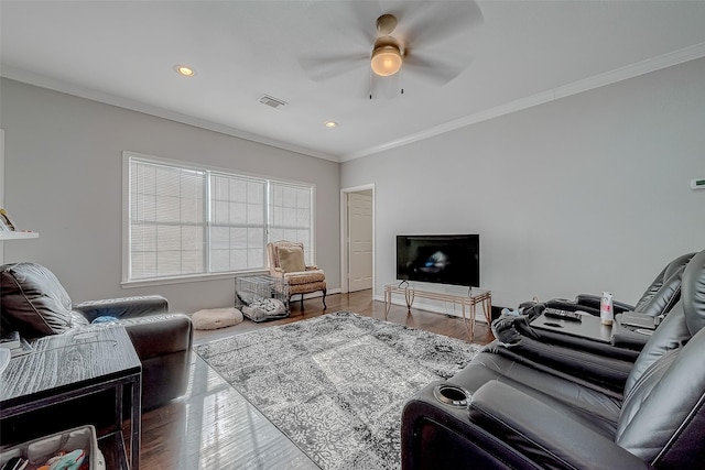 living room with ceiling fan, ornamental molding, and wood-type flooring