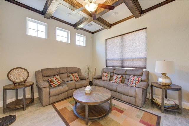 living room featuring coffered ceiling, crown molding, ceiling fan, beamed ceiling, and light hardwood / wood-style floors