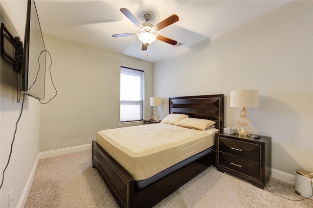 bedroom featuring ceiling fan and light carpet