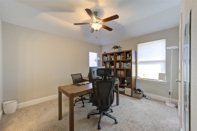 carpeted home office with ceiling fan