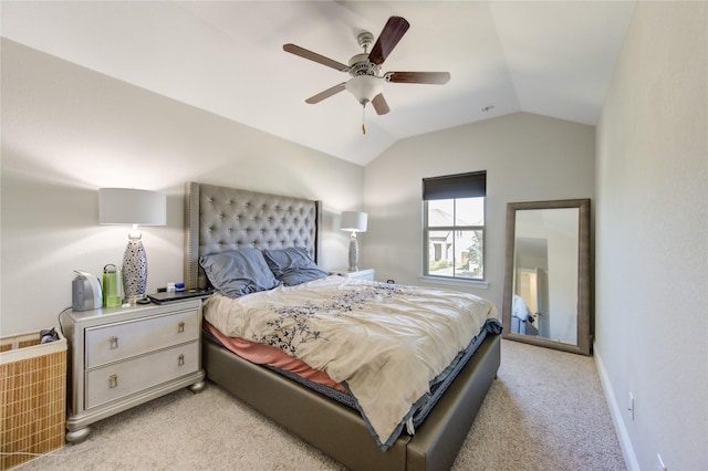 carpeted bedroom featuring ceiling fan and lofted ceiling