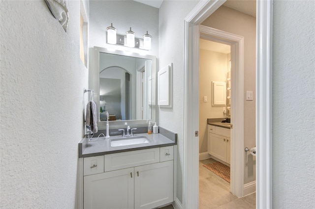 bathroom featuring tile patterned floors and vanity