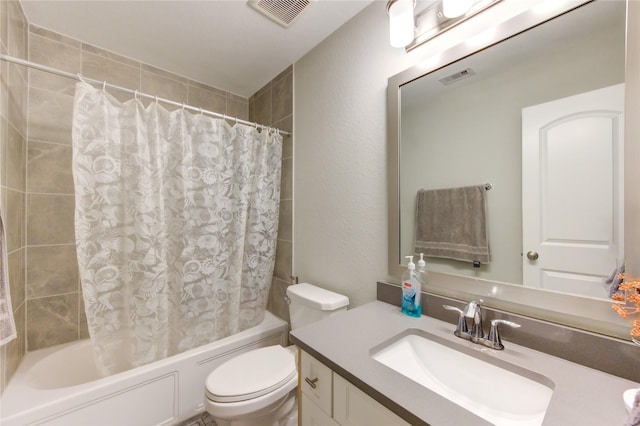 full bathroom featuring shower / bath combo, vanity, and toilet