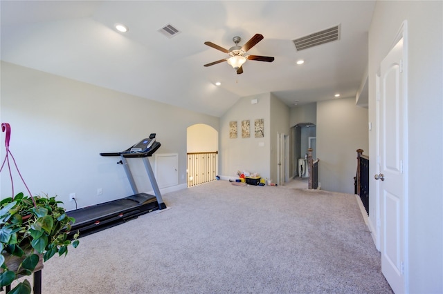 exercise room with ceiling fan, carpet, and vaulted ceiling