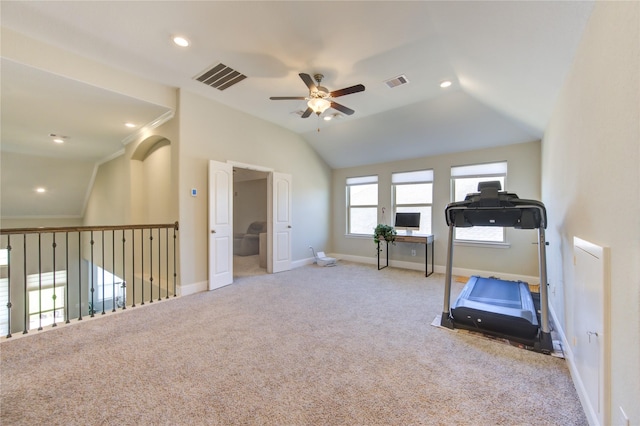 workout room featuring light carpet, ceiling fan, and lofted ceiling