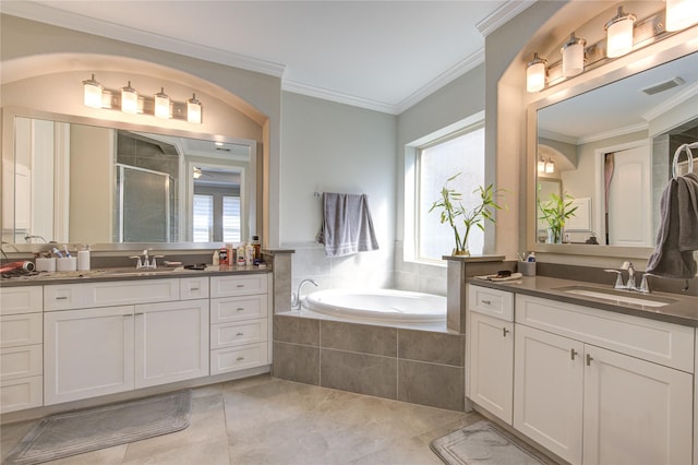 bathroom featuring vanity, a healthy amount of sunlight, crown molding, and plus walk in shower