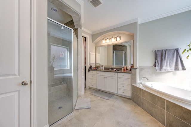 bathroom with tile patterned floors, vanity, crown molding, and independent shower and bath