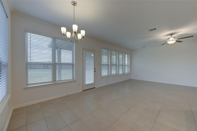 unfurnished dining area featuring light tile patterned floors, ceiling fan with notable chandelier, and a wealth of natural light