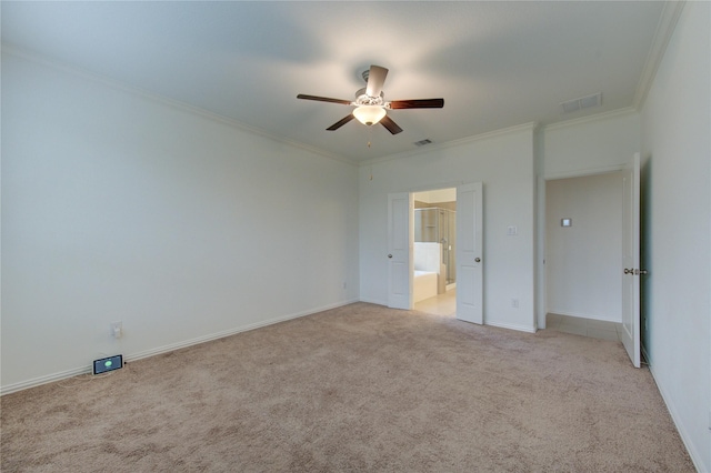 unfurnished bedroom featuring ensuite bath, ceiling fan, light carpet, and ornamental molding