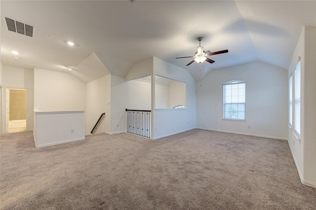 bonus room featuring ceiling fan, light colored carpet, and vaulted ceiling