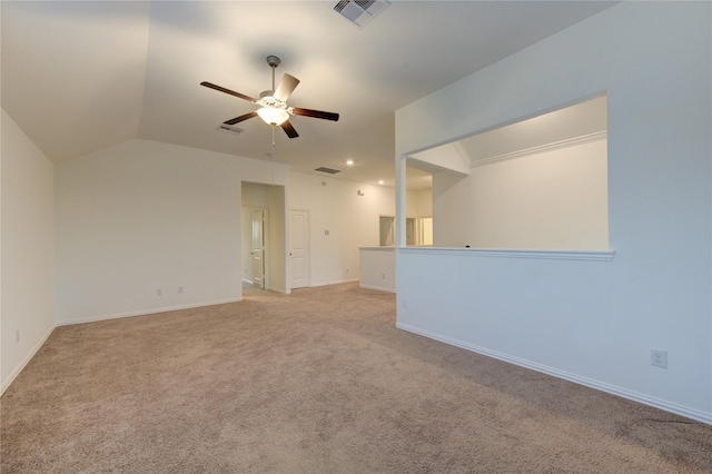 carpeted empty room with ceiling fan and lofted ceiling