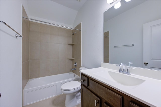 full bathroom with vanity, vaulted ceiling, toilet, and tiled shower / bath