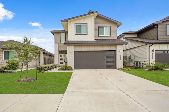 view of front facade featuring a garage and a front lawn