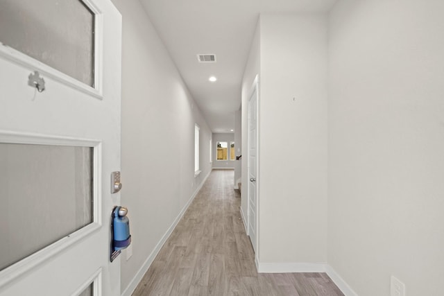 hallway featuring light wood-type flooring