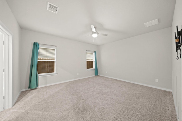 empty room with light carpet and ceiling fan