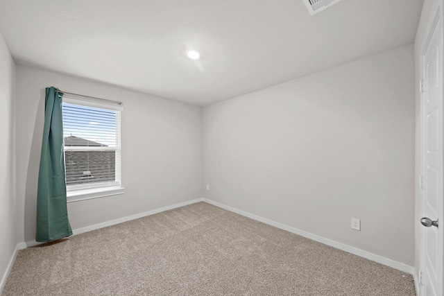 unfurnished room featuring carpet