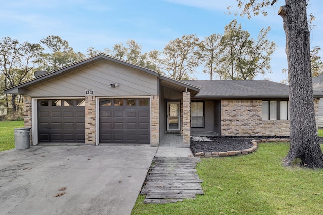 single story home featuring a front yard and a garage