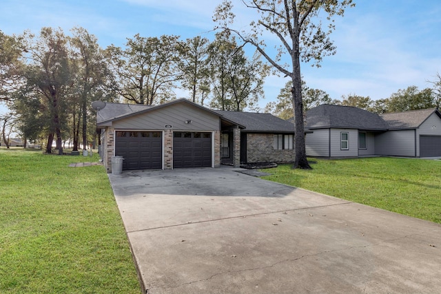 ranch-style house featuring a garage and a front yard