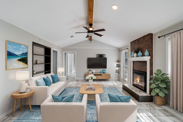 living room featuring a tile fireplace, lofted ceiling with beams, and ceiling fan